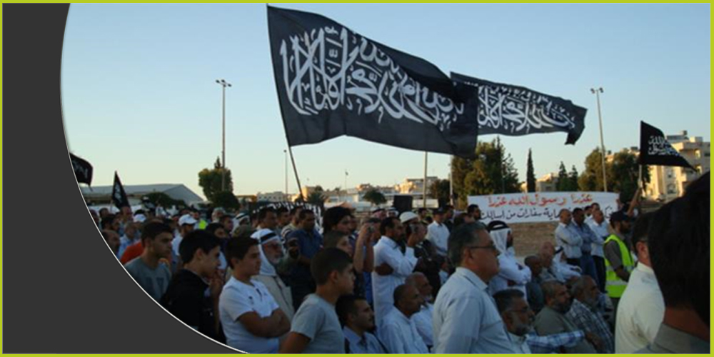 متظاهرون من حزب التحرير في عمّان يرفعون &quot;راية العقاب&quot;